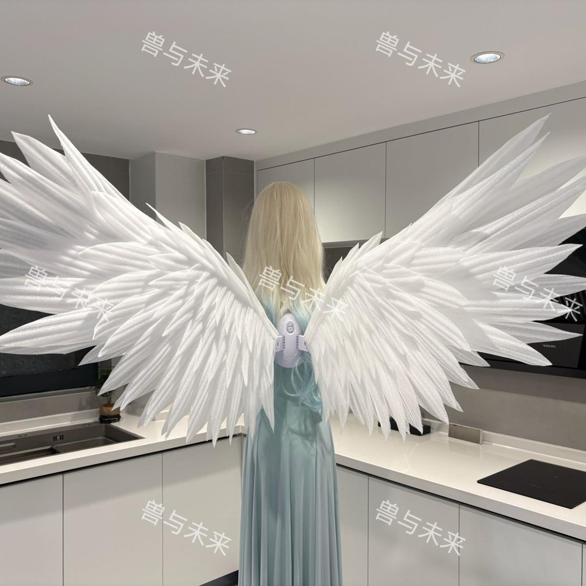 White classic motorized angel wings spread open