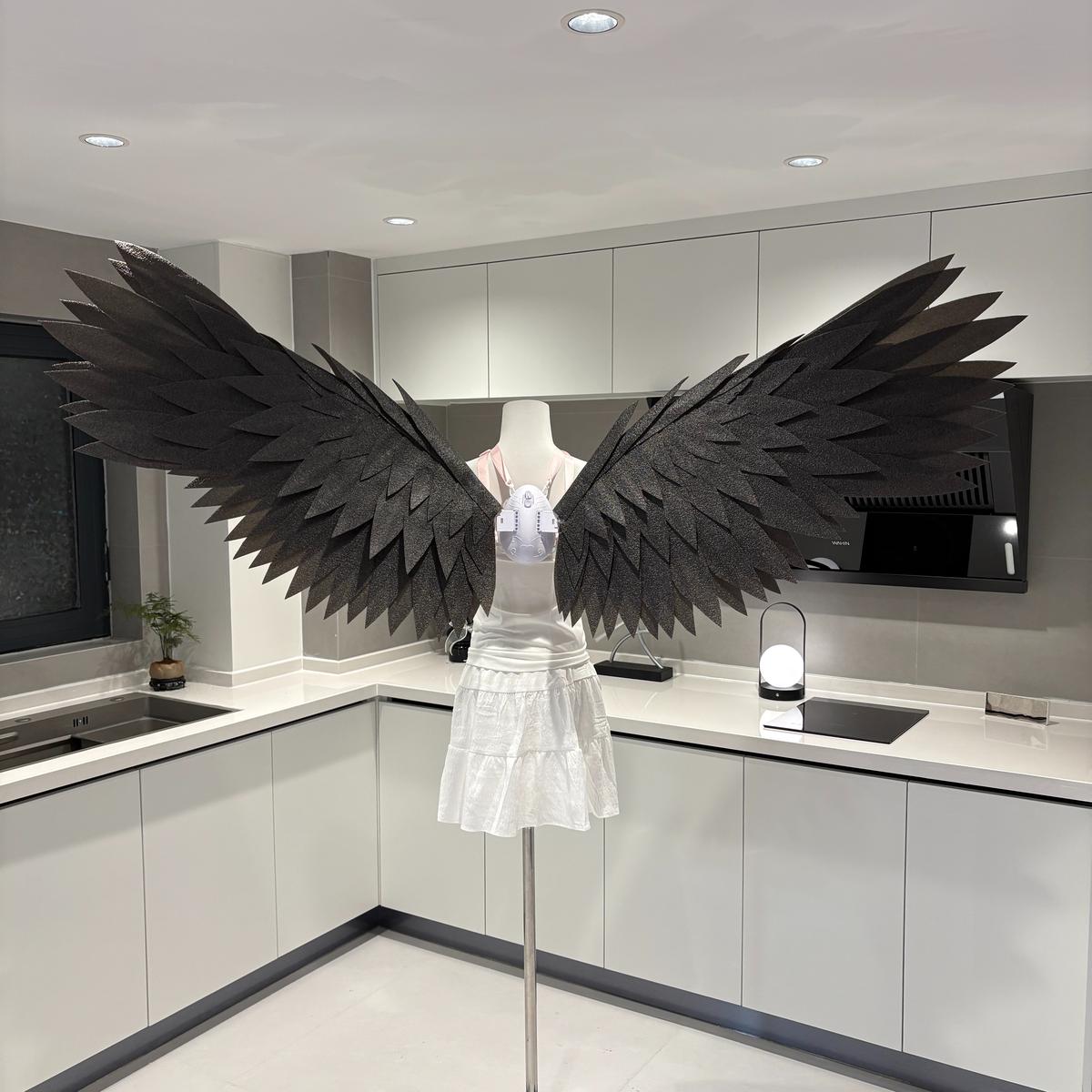 Black classic motorized angel wings on a mannequin