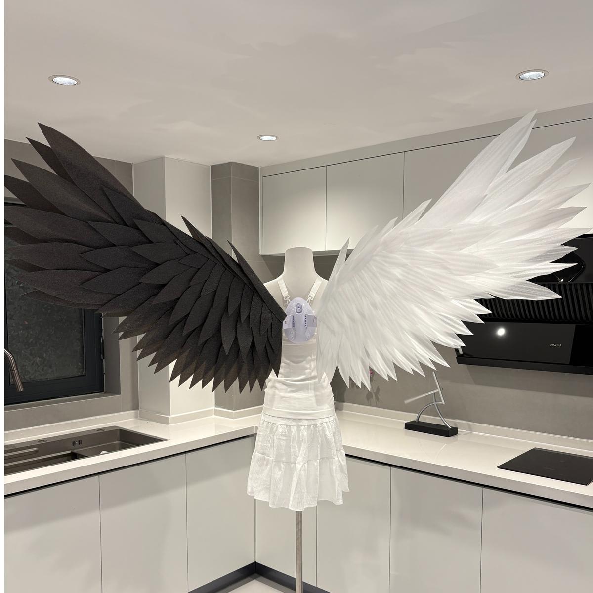 Classic angel wings with one black wing and one white wing