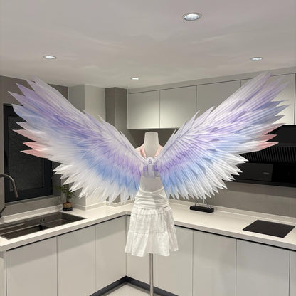 Classic angel wings in pastel purple, blue, and pink