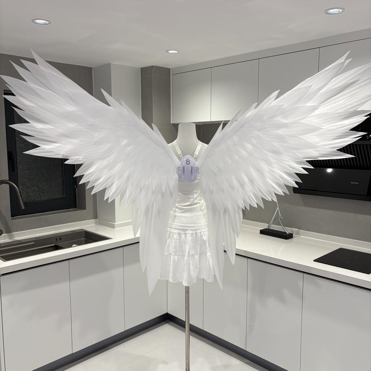 White swallowtail motorized angel wings with long lower tips