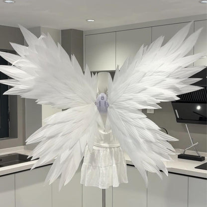 White butterfly-style angel wings on a mannequin