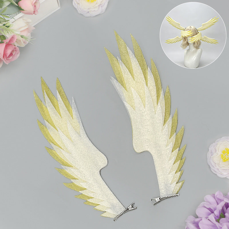Pair of white and yellow angel wing hair clips