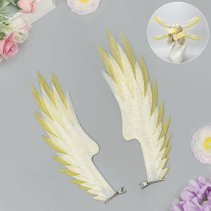 Pair of white and yellow angel wing hair clips